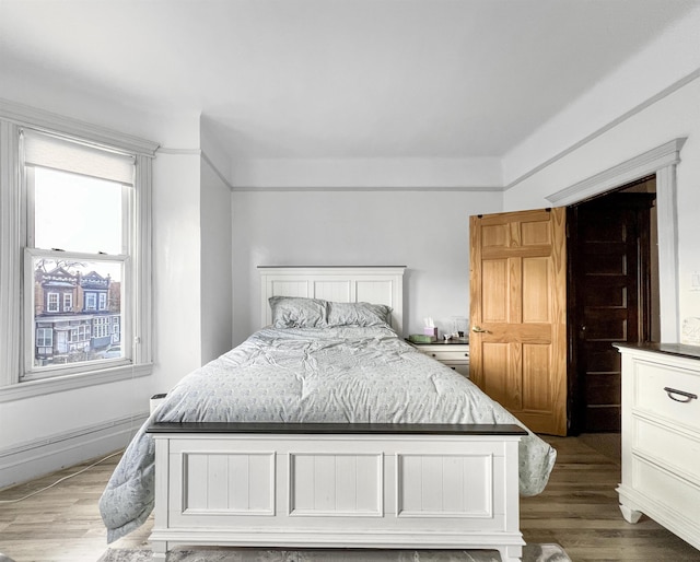 bedroom featuring wood-type flooring