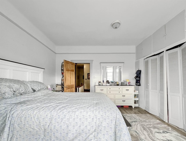 bedroom with light hardwood / wood-style flooring