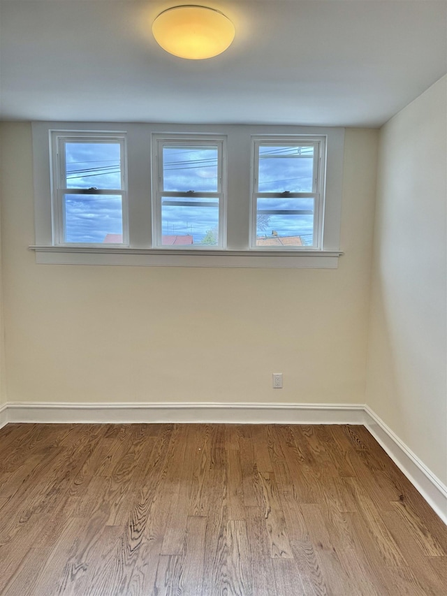3 Raydol Ave, Secaucus, NJ 07094 - empty room with baseboards and wood finished floors