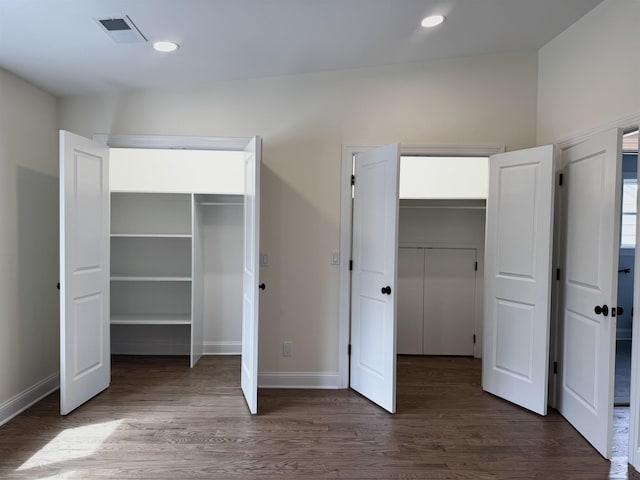 3 Raydol Ave, Secaucus, NJ 07094 - unfurnished bedroom featuring wood finished floors, two closets, and recessed lighting
