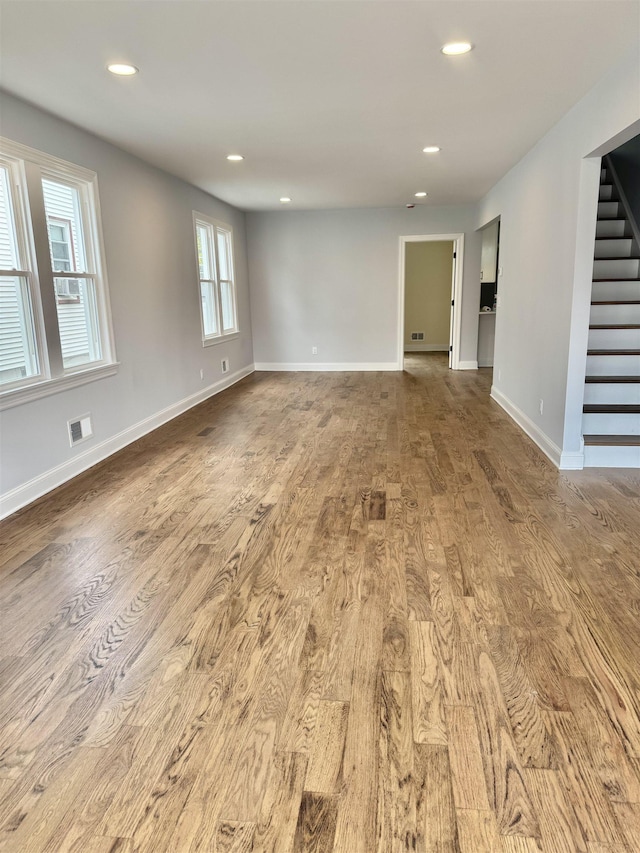 3 Raydol Ave, Secaucus, NJ 07094 - empty room featuring wood finished floors, stairway, and recessed lighting
