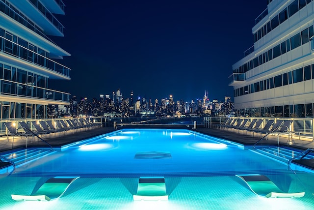 view of pool at night