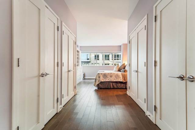 corridor with dark hardwood / wood-style floors