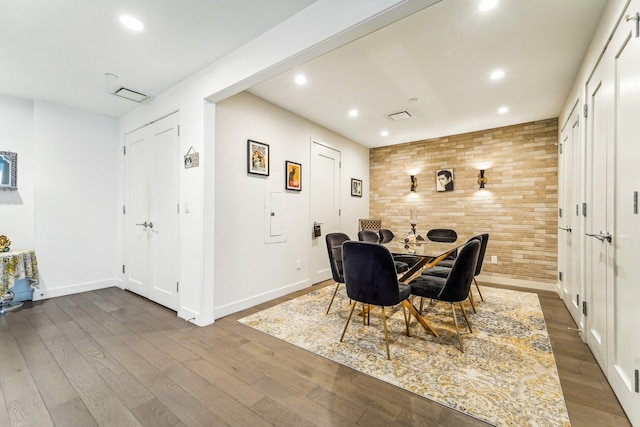 dining area with hardwood / wood-style flooring