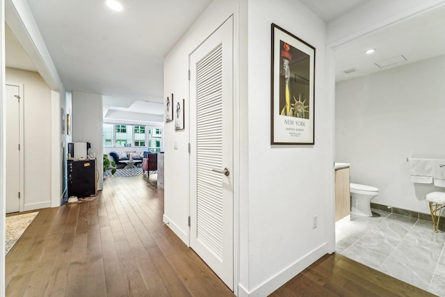 hallway with wood-type flooring