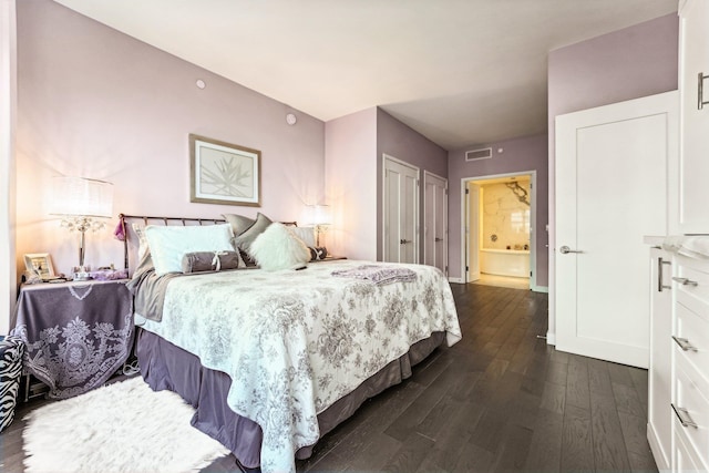 bedroom with dark hardwood / wood-style flooring