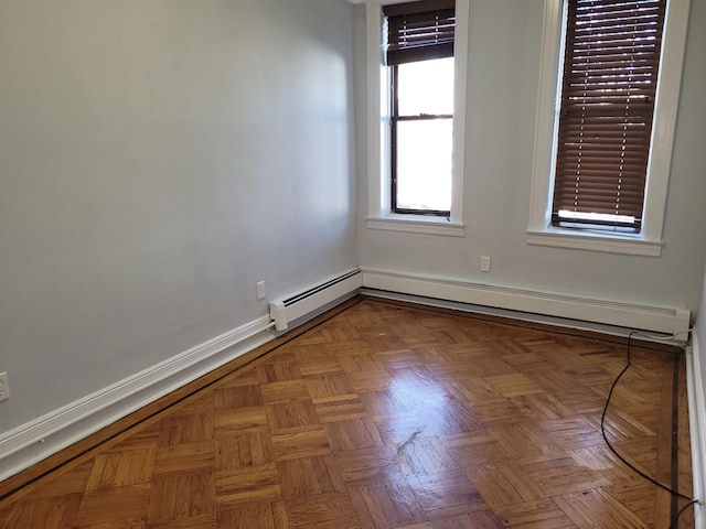 empty room featuring baseboards