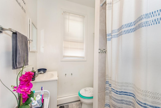 full bathroom with baseboard heating, toilet, vanity, and a shower with shower curtain