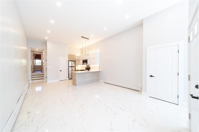 481 Martin Luther King Jr Dr, Jersey City, NJ 07304 - unfurnished living room with a baseboard heating unit, marble finish floor, baseboards, and recessed lighting