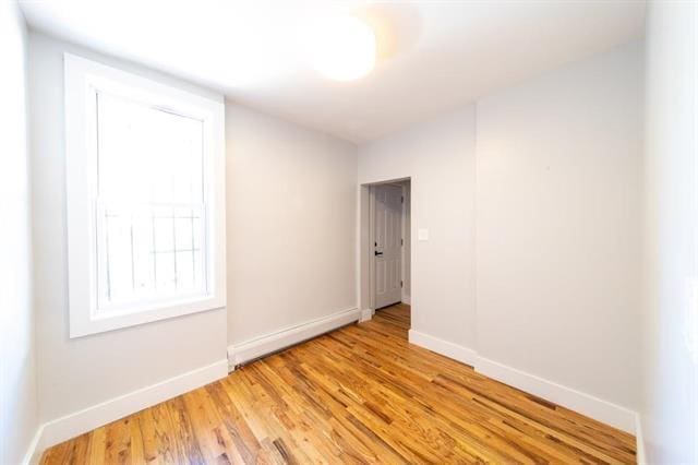481 Martin Luther King Jr Dr, Jersey City, NJ 07304 - unfurnished room with baseboards and light wood-type flooring