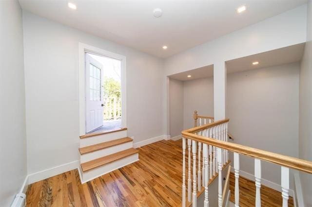 481 Martin Luther King Jr Dr, Jersey City, NJ 07304 - hallway with wood finished floors, baseboards, an upstairs landing, and recessed lighting