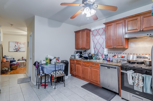 27 W 4th St, Bayonne, NJ 07002 - kitchen with appliances with stainless steel finishes, under cabinet range hood, tasteful backsplash, and a ceiling fan