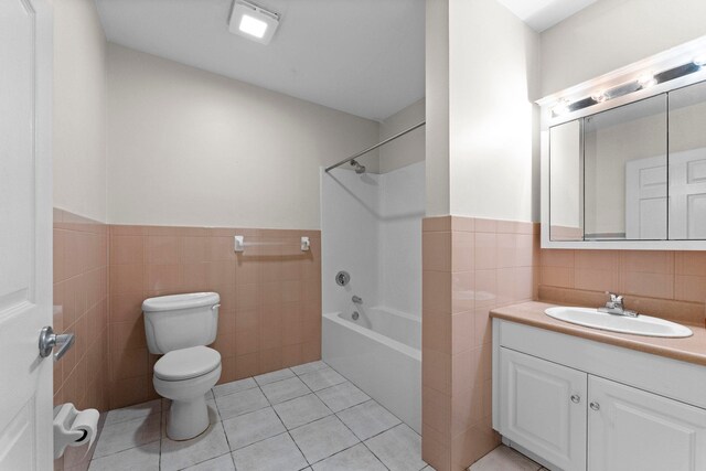 8915 Bergenwood Ave Unit 37, North Bergen, NJ 07047 - full bath featuring tile walls, vanity, tile patterned flooring, curtained shower, and a wainscoted wall