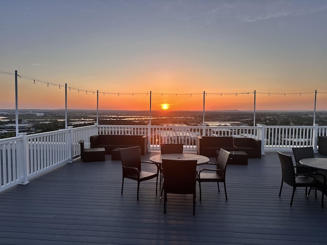 8915 Bergenwood Ave Unit 37, North Bergen, NJ 07047 - deck at dusk featuring outdoor dining area and an outdoor hangout area