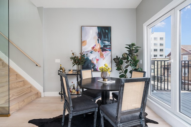 dining area with light hardwood / wood-style flooring