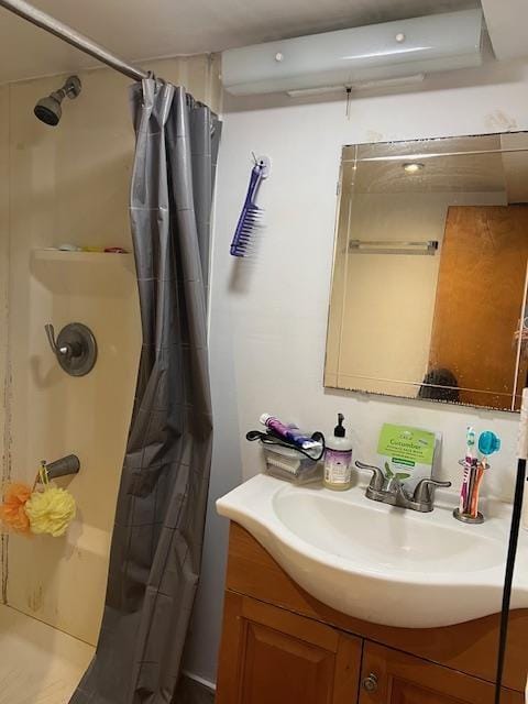 full bathroom with a shower with shower curtain and vanity