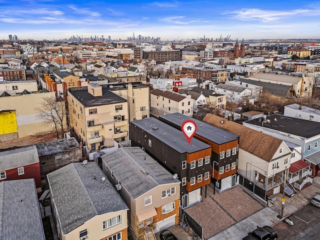 birds eye view of property featuring a city view