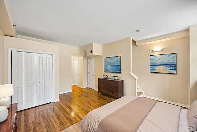 341 Monmouth St Unit 104D, Jersey City, NJ 07302 - bedroom featuring wood finished floors and a closet