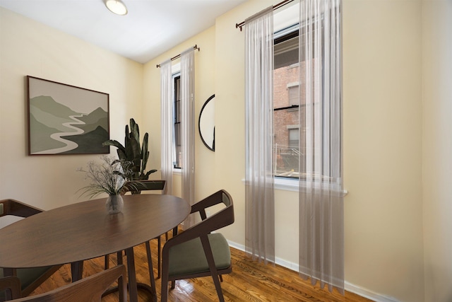 341 Monmouth St Unit 104D, Jersey City, NJ 07302 - dining space featuring wood finished floors and plenty of natural light