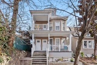 view of front of property with a balcony and a porch