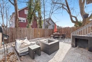 view of patio / terrace featuring a fire pit