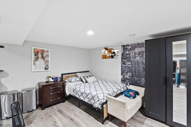 bedroom with light hardwood / wood-style floors