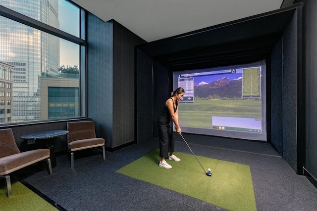 99 Hudson St Unit 4903, Jersey City, NJ 07302 - recreation room with golf simulator, carpet floors, and plenty of natural light