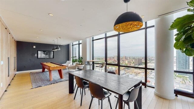 10 Provost St Unit 1004, Jersey City, NJ 07302 - dining area with a wall of windows, light wood-style floors, a city view, and billiards table