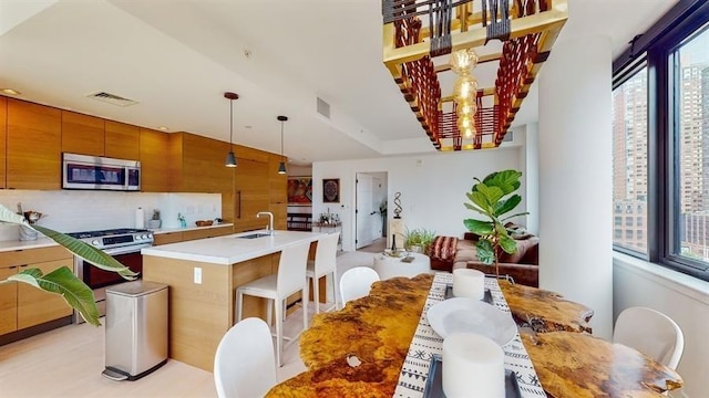 10 Provost St Unit 1004, Jersey City, NJ 07302 - dining area featuring healthy amount of natural light and a chandelier