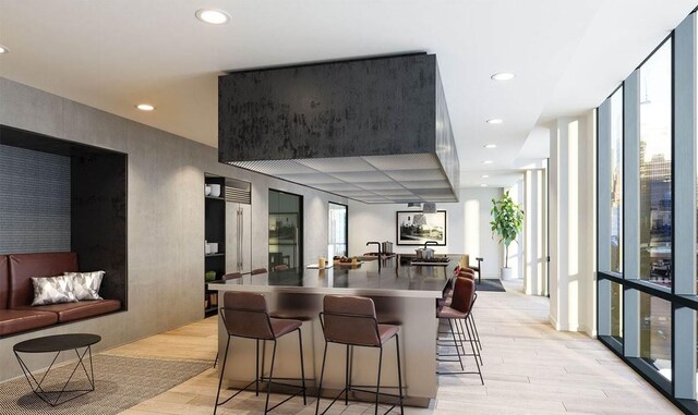 10 Provost St Unit 1004, Jersey City, NJ 07302 - kitchen featuring healthy amount of natural light, light wood-type flooring, a breakfast bar, recessed lighting, and open floor plan