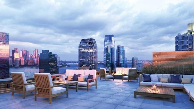 10 Provost St Unit 1004, Jersey City, NJ 07302 - patio terrace at dusk with an outdoor living space with a fire pit and a view of skyline