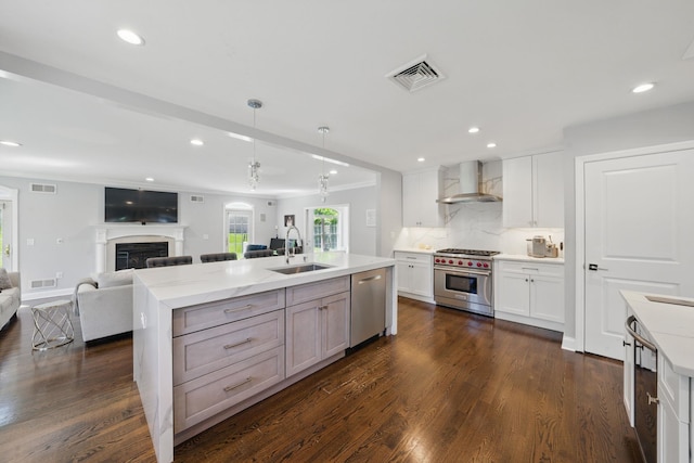 12 Stephen Pl, Little Falls, NJ 07424 - kitchen with appliances with stainless steel finishes, ventilation hood, a sink, open floor plan, and dark wood-type flooring