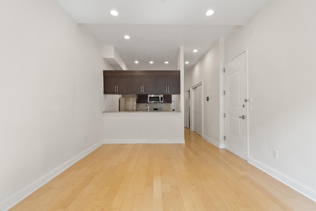 104 Tidewater St Unit 1A, Jersey City, NJ 07302 - unfurnished living room featuring light wood finished floors and recessed lighting