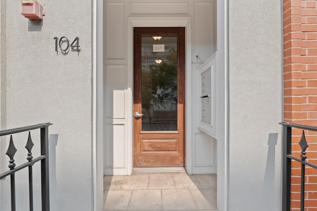 104 Tidewater St Unit 1A, Jersey City, NJ 07302 - doorway to property featuring stucco siding