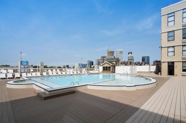 104 Tidewater St Unit 1A, Jersey City, NJ 07302 - community pool featuring a hot tub, a view of skyline, and a deck