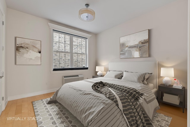 104 Tidewater St Unit 1A, Jersey City, NJ 07302 - bedroom with light wood finished floors and a wall mounted AC