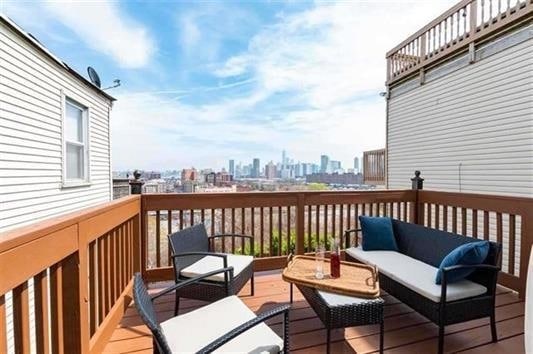 deck with an outdoor hangout area