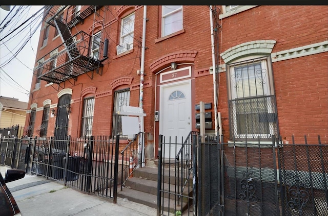 37 Harmon St, Jersey City, NJ 07304 - exterior space with fence and brick siding