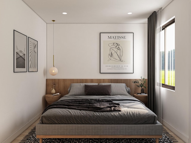 bedroom with hardwood / wood-style flooring