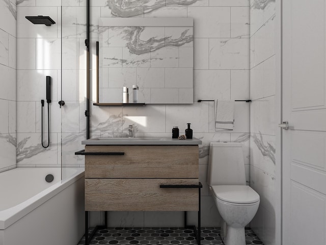 full bathroom with tile walls, vanity,  shower combination, tile patterned flooring, and toilet