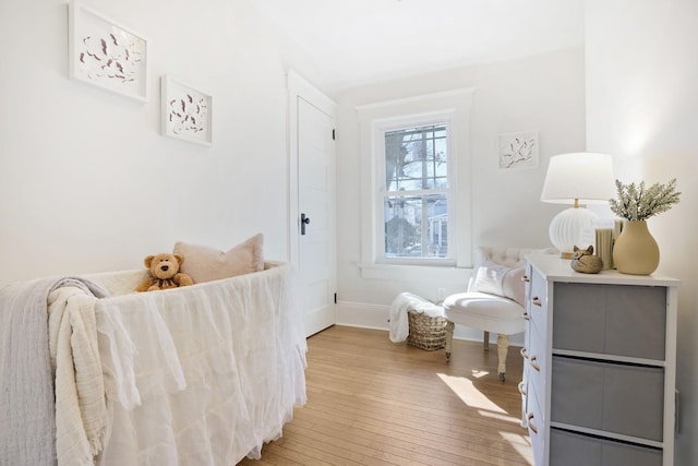 interior space featuring baseboards and hardwood / wood-style flooring