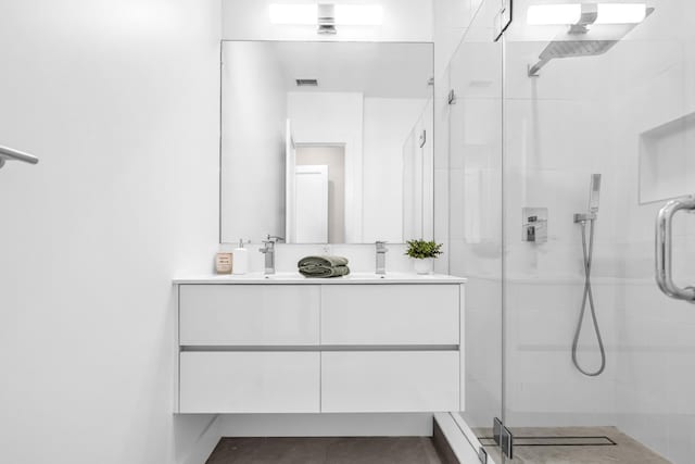 2602 Palisade Ave, Weehawken, NJ 07086 - full bathroom with a stall shower and double vanity