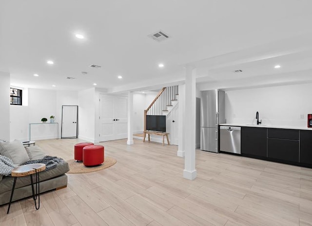 2602 Palisade Ave, Weehawken, NJ 07086 - living area featuring stairway, recessed lighting, light wood-type flooring, and baseboards