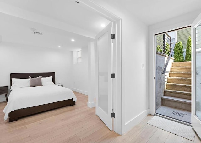 2602 Palisade Ave, Weehawken, NJ 07086 - bedroom featuring wood finished floors, baseboards, access to exterior, and recessed lighting