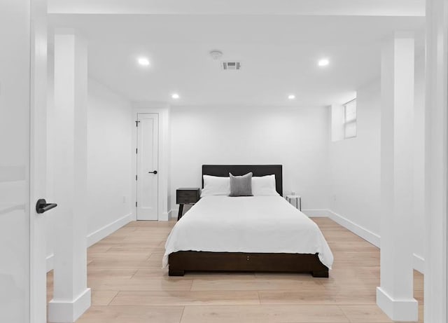 2602 Palisade Ave, Weehawken, NJ 07086 - bedroom with baseboards, recessed lighting, and light wood-style flooring