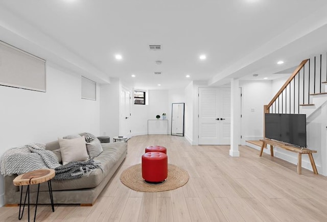 2602 Palisade Ave, Weehawken, NJ 07086 - living room with recessed lighting, light wood-style floors, stairway, and baseboards