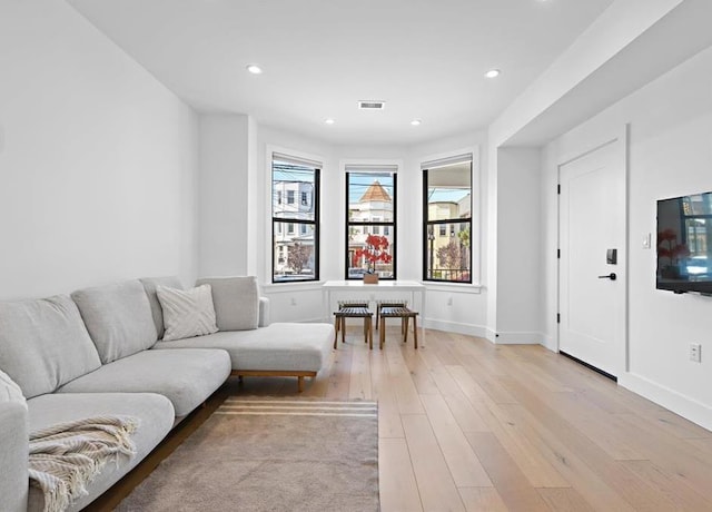 2602 Palisade Ave, Weehawken, NJ 07086 - living area featuring light wood-style flooring, recessed lighting, and baseboards