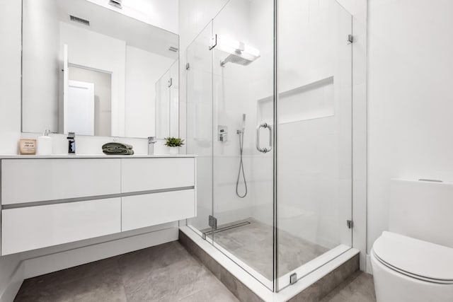 2602 Palisade Ave, Weehawken, NJ 07086 - bathroom featuring vanity, a shower stall, toilet, and tile patterned flooring