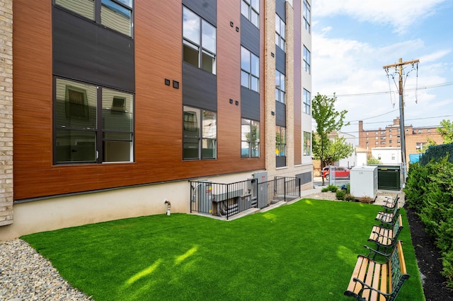 exterior space with fence and central air condition unit