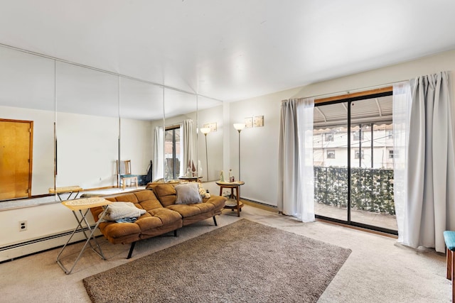 living room featuring baseboard heating and carpet flooring